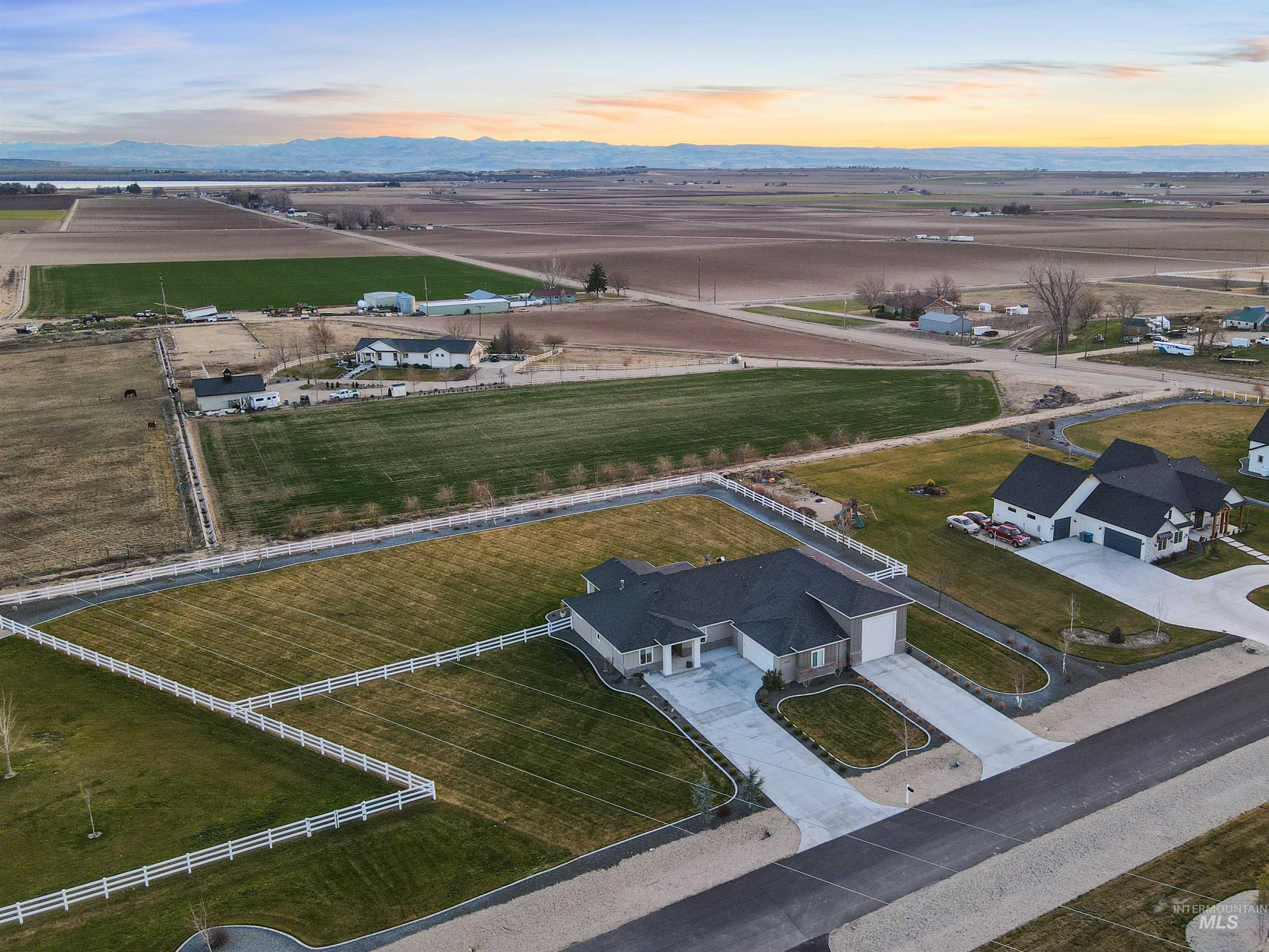 16901 Spring Meadow Drive Caldwell, ID 83607 - Photo 48 of 50 Aerial view at dusk of a rural view and a mountain view