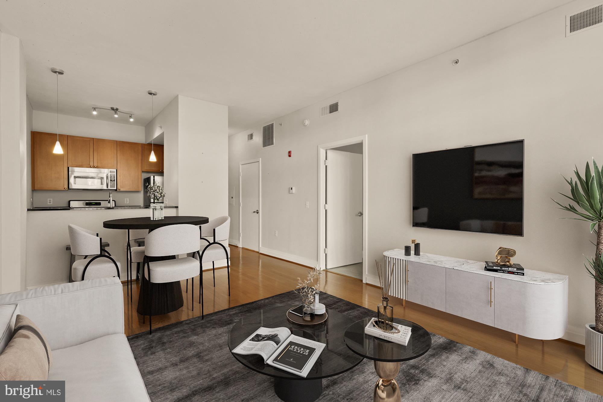 a living room with furniture and a flat screen tv