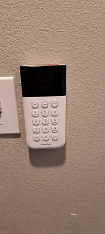 a view of a yard with wooden fence