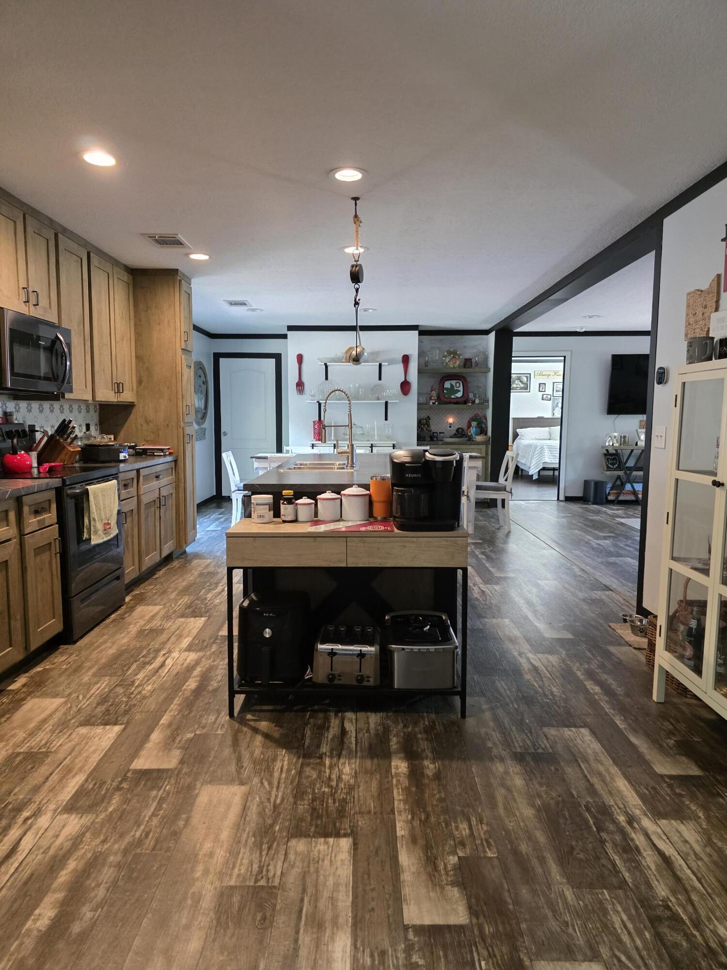 4320 Highway 79 Vernon, FL 32462 - Photo 14 of 49 a living room with furniture flat screen tv and pool table