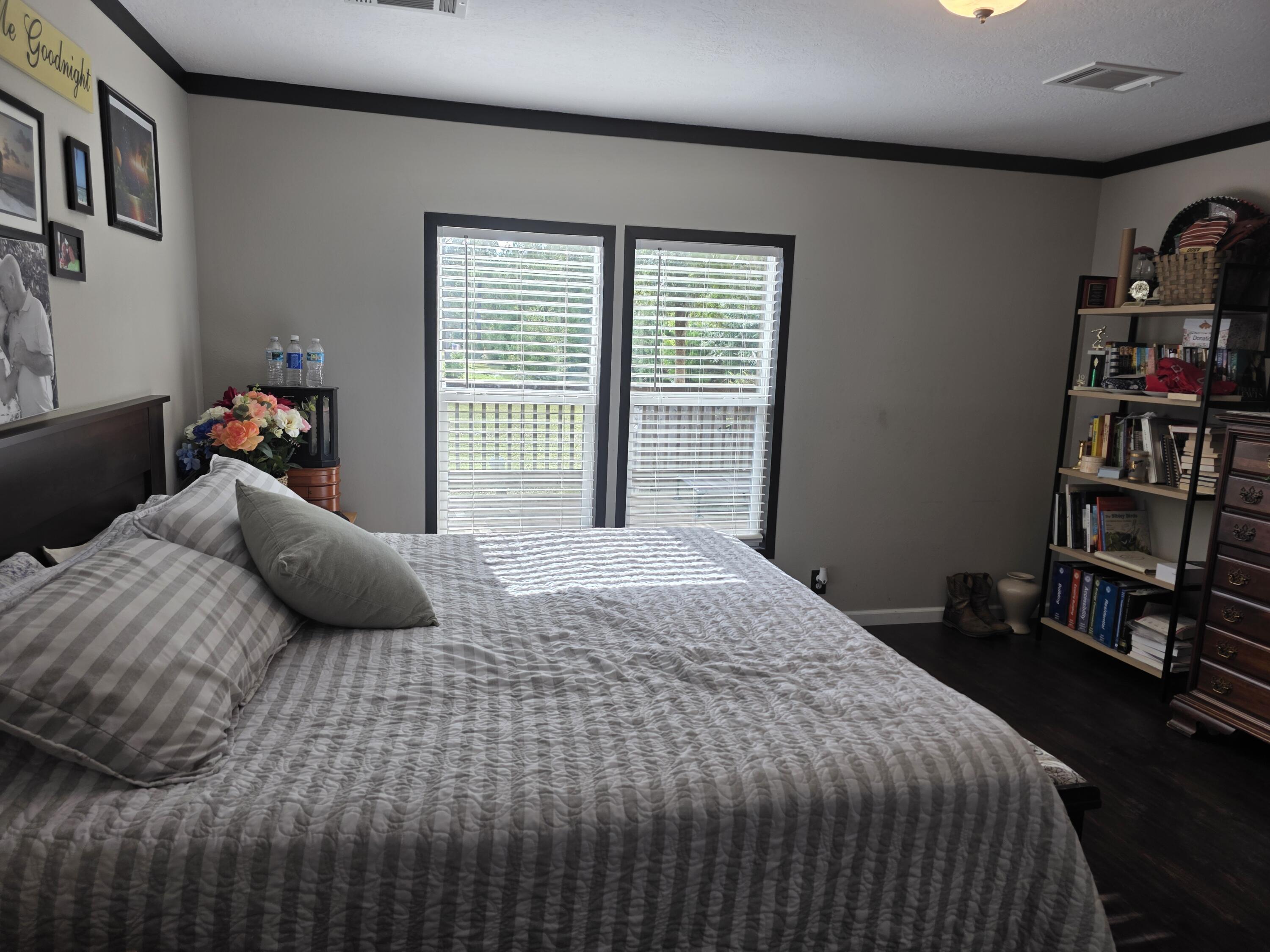 4320 Highway 79 Vernon, FL 32462 - Photo 20 of 49 a bedroom with a bed and a book shelf