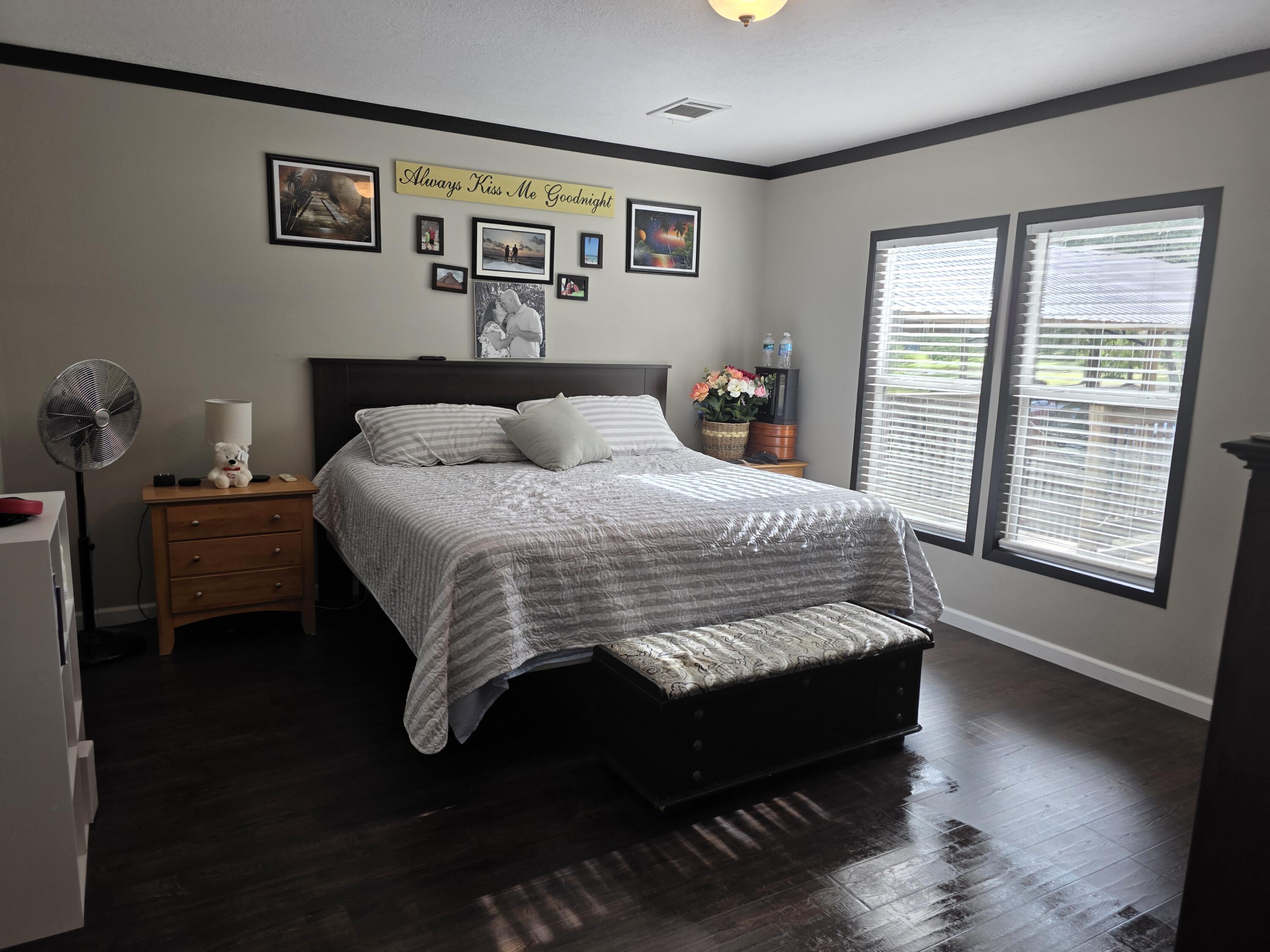 4320 Highway 79 Vernon, FL 32462 - Photo 21 of 49 a bedroom with a bed and wooden floor