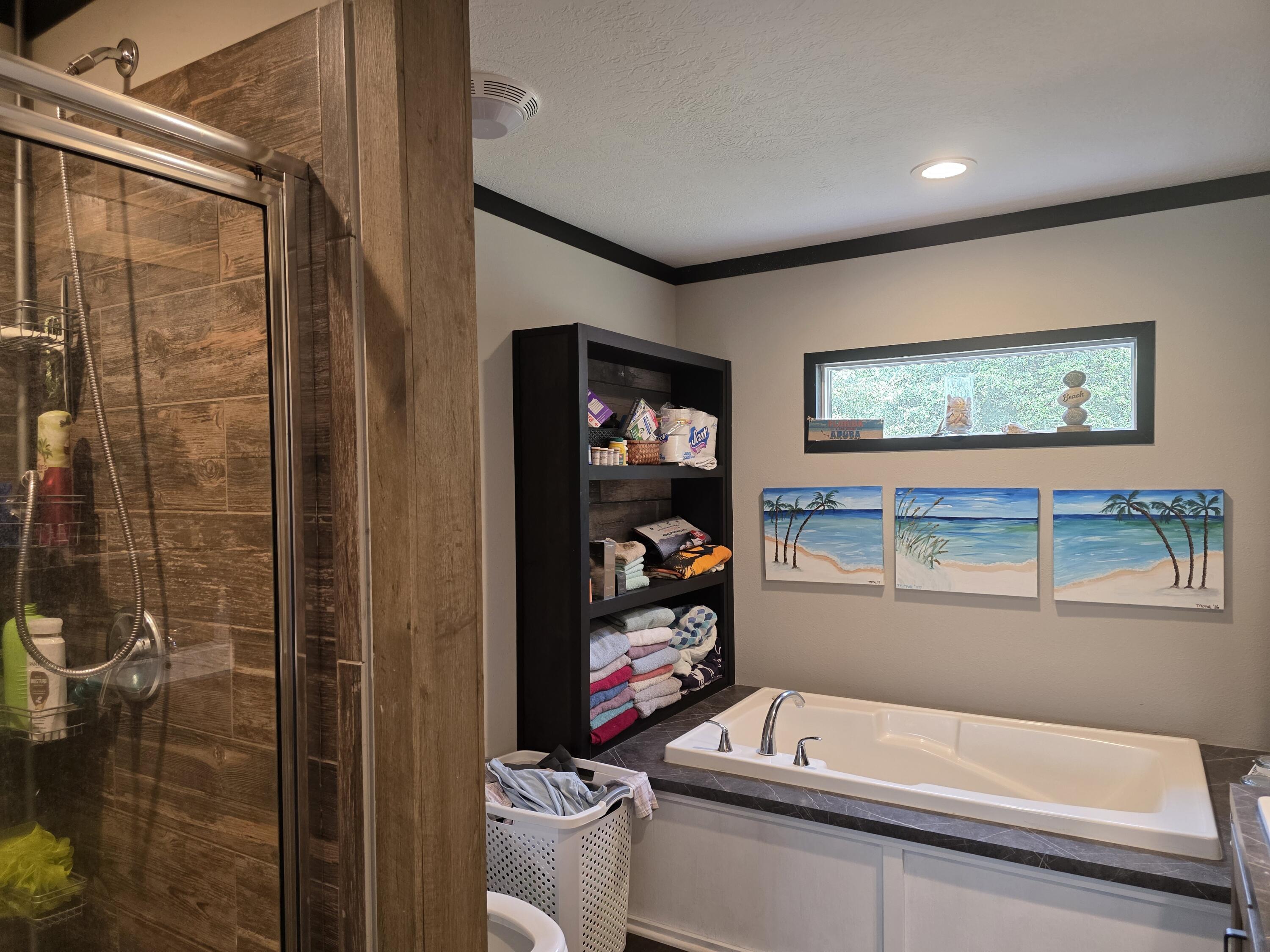 4320 Highway 79 Vernon, FL 32462 - Photo 24 of 49 a bathroom with a tub and a shower