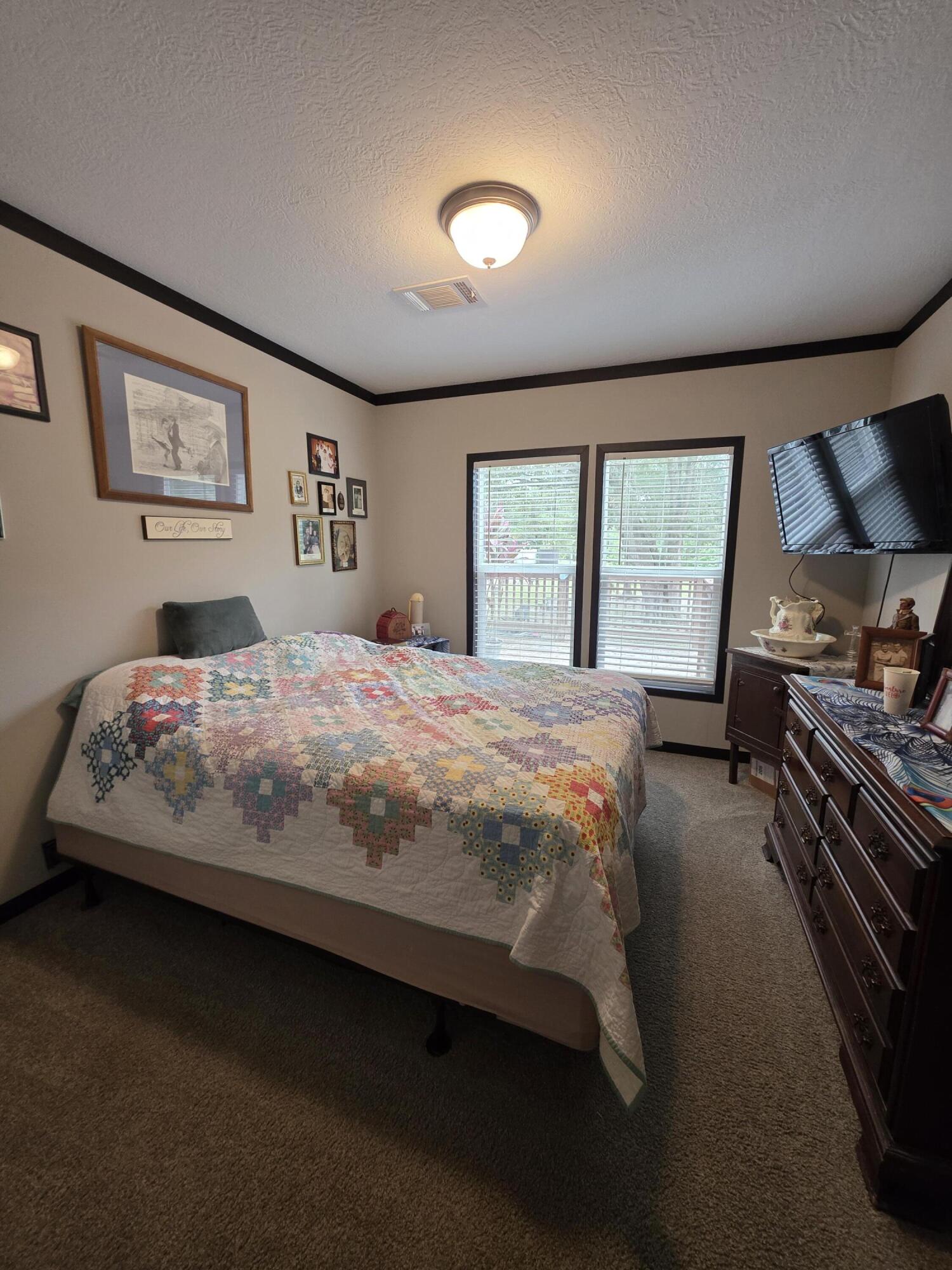 4320 Highway 79 Vernon, FL 32462 - Photo 26 of 49 a bedroom with a bed and a large window
