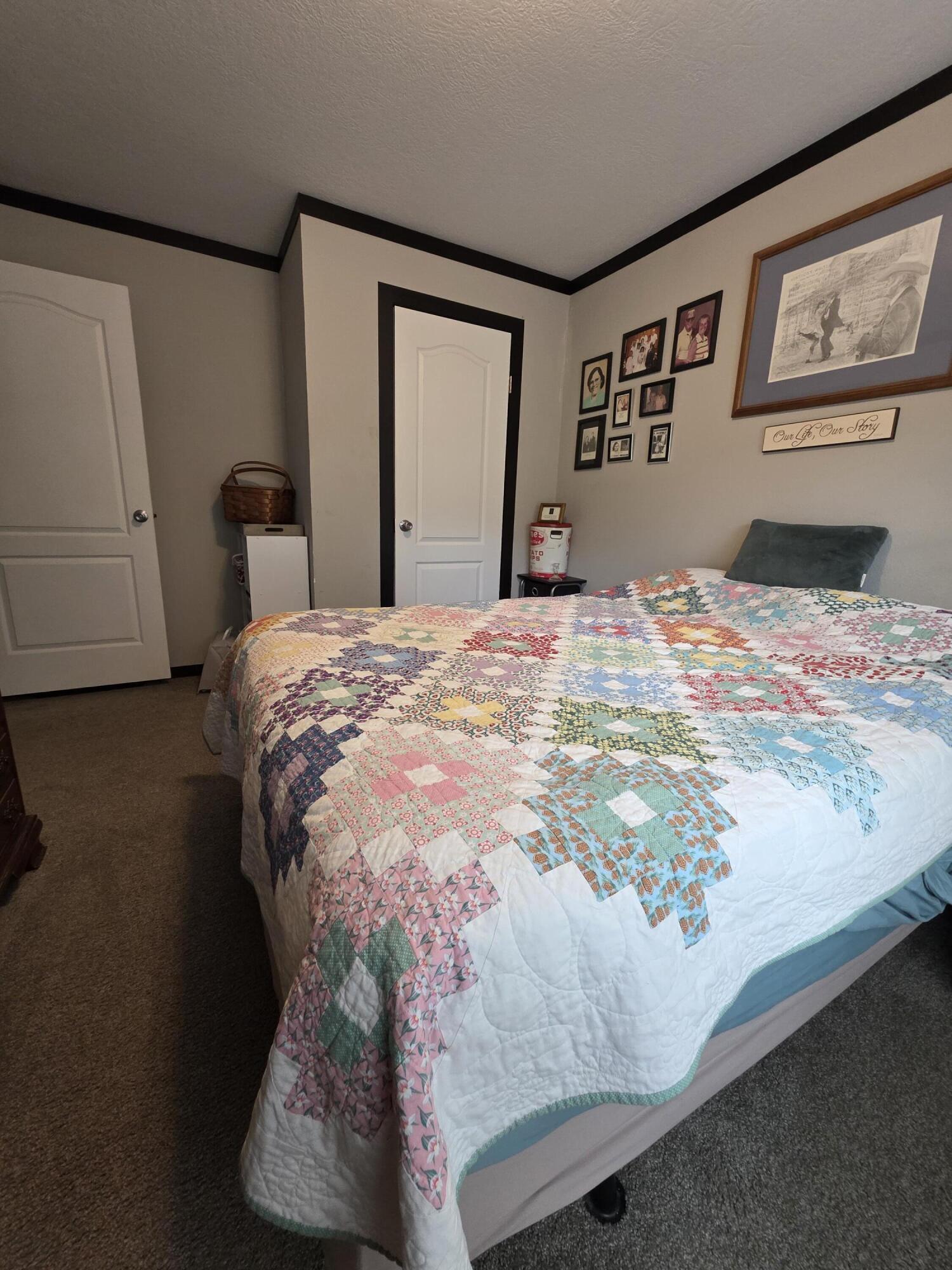 4320 Highway 79 Vernon, FL 32462 - Photo 27 of 49 a bedroom with a bed and painting on the wall