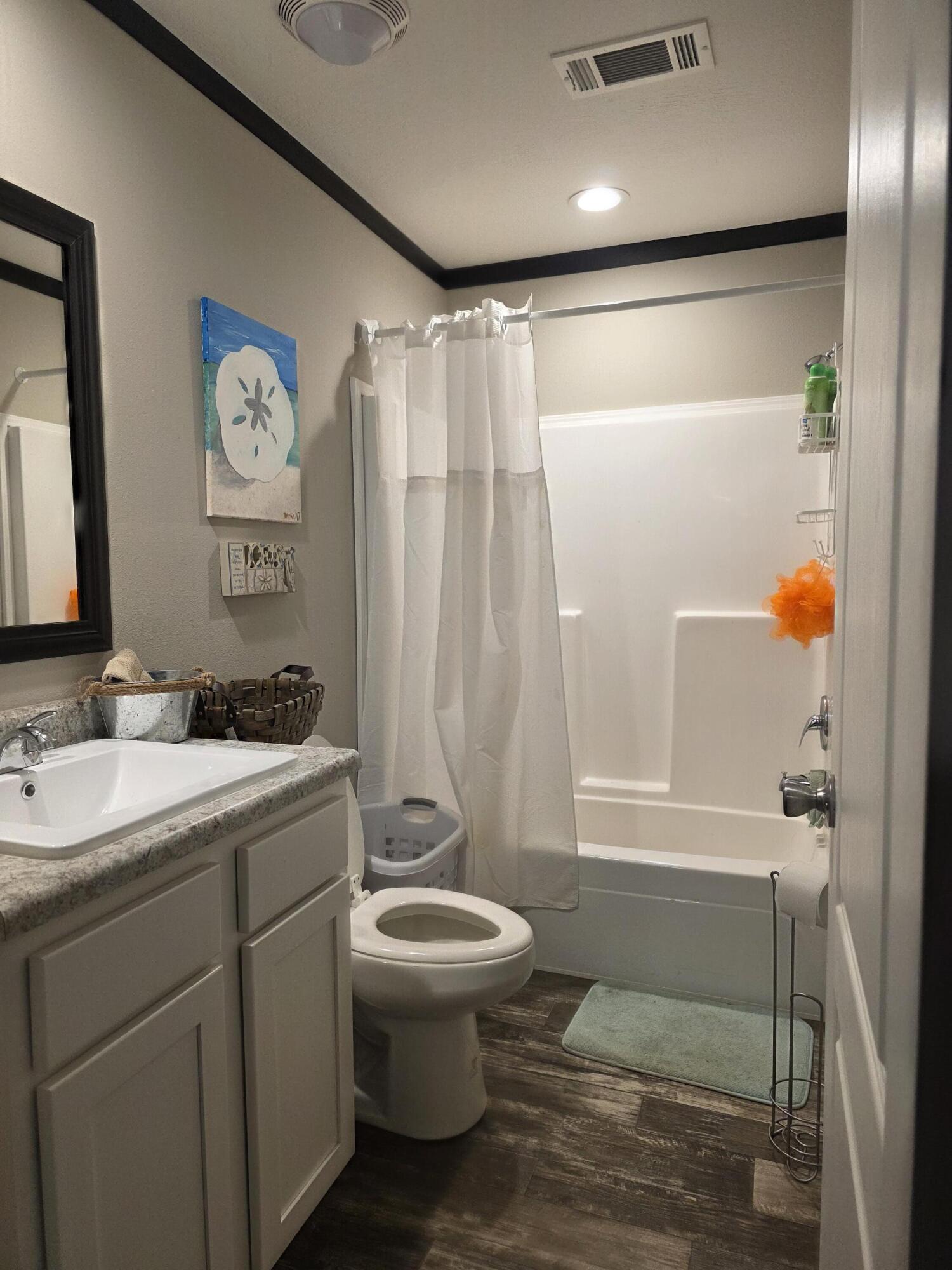 4320 Highway 79 Vernon, FL 32462 - Photo 31 of 49 a bathroom with a granite countertop sink toilet and shower