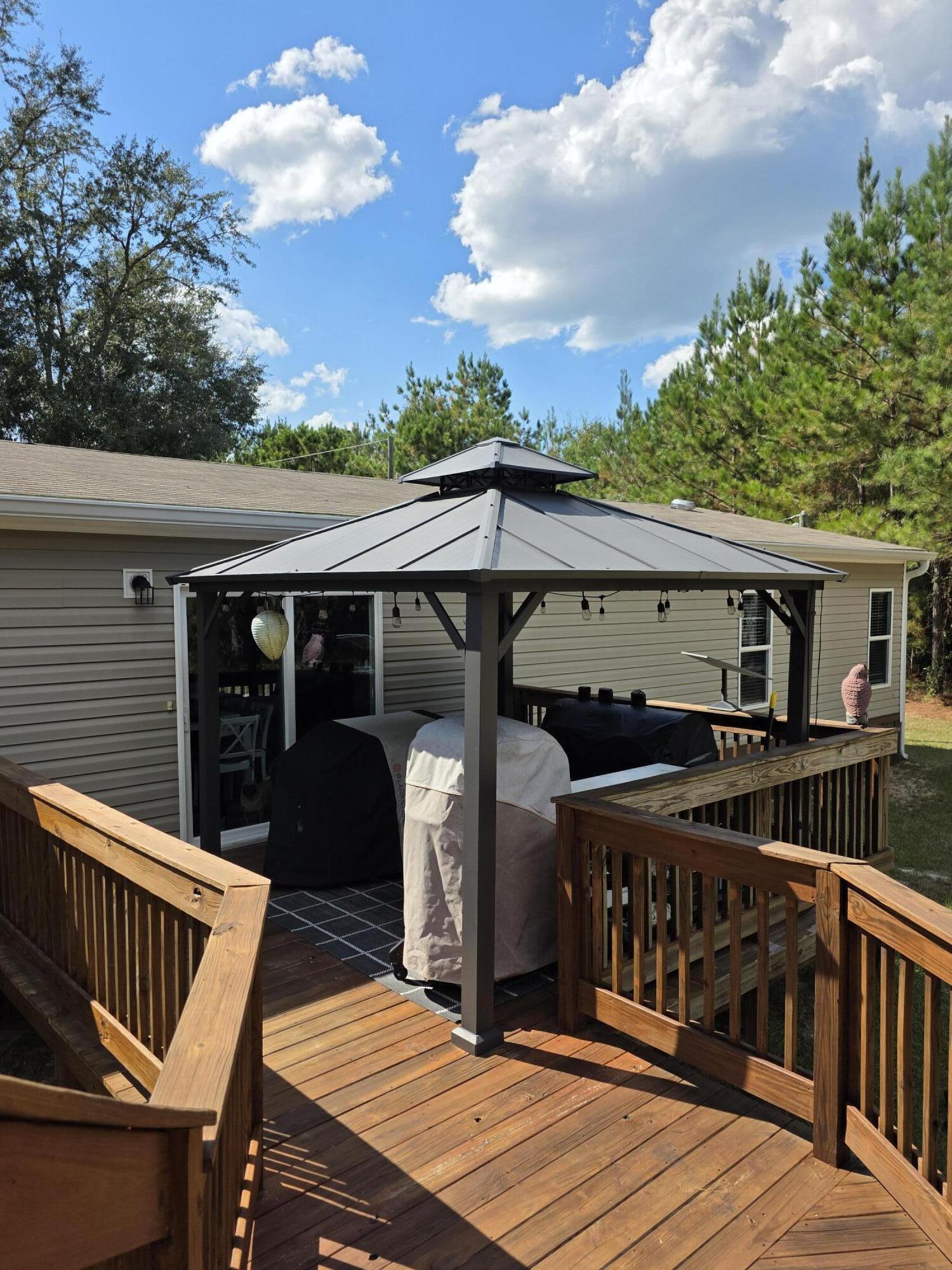 4320 Highway 79 Vernon, FL 32462 - Photo 32 of 49 a view of house with roof deck and furniture
