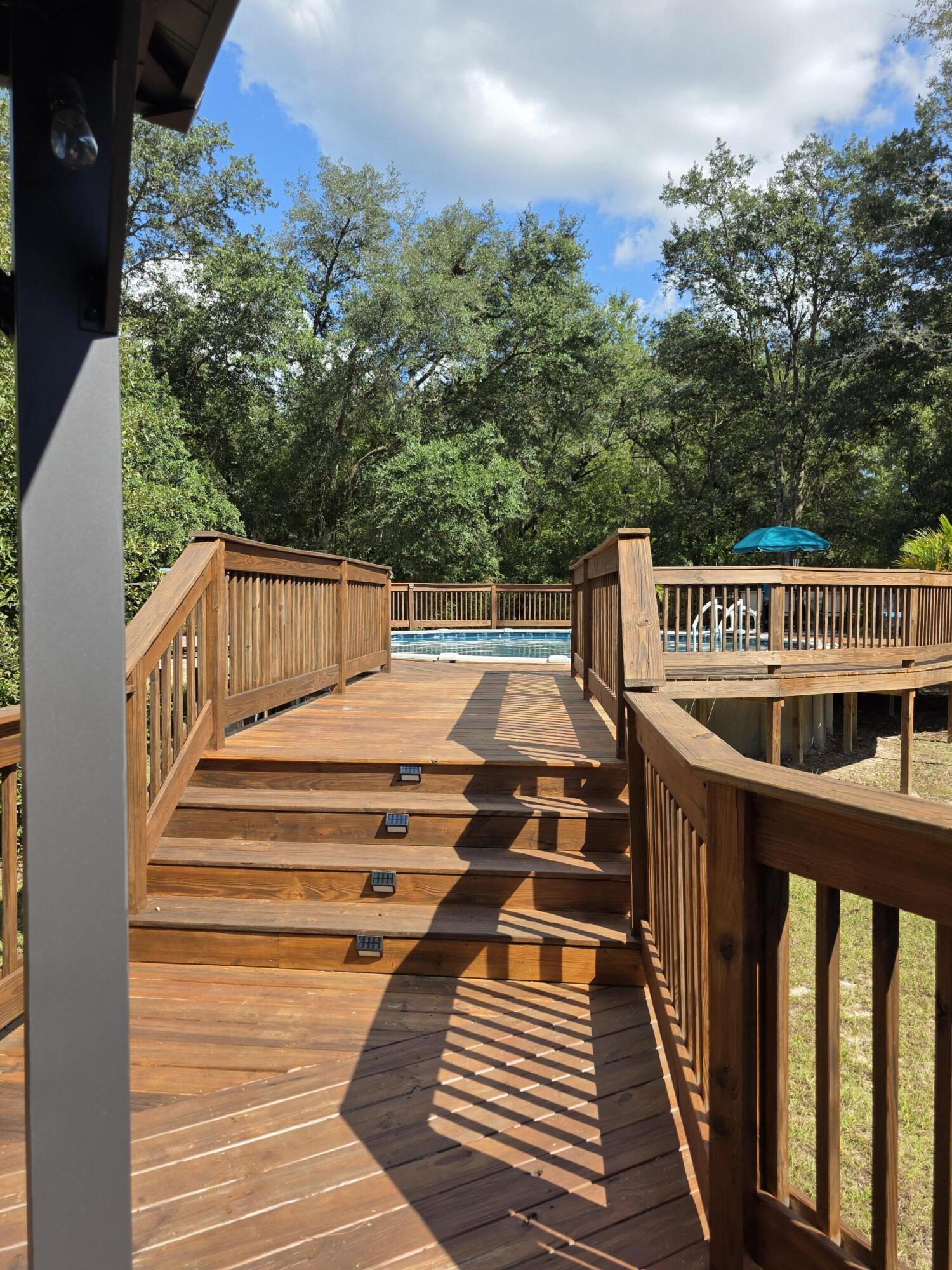 4320 Highway 79 Vernon, FL 32462 - Photo 33 of 49 a balcony with wooden floor and outdoor space