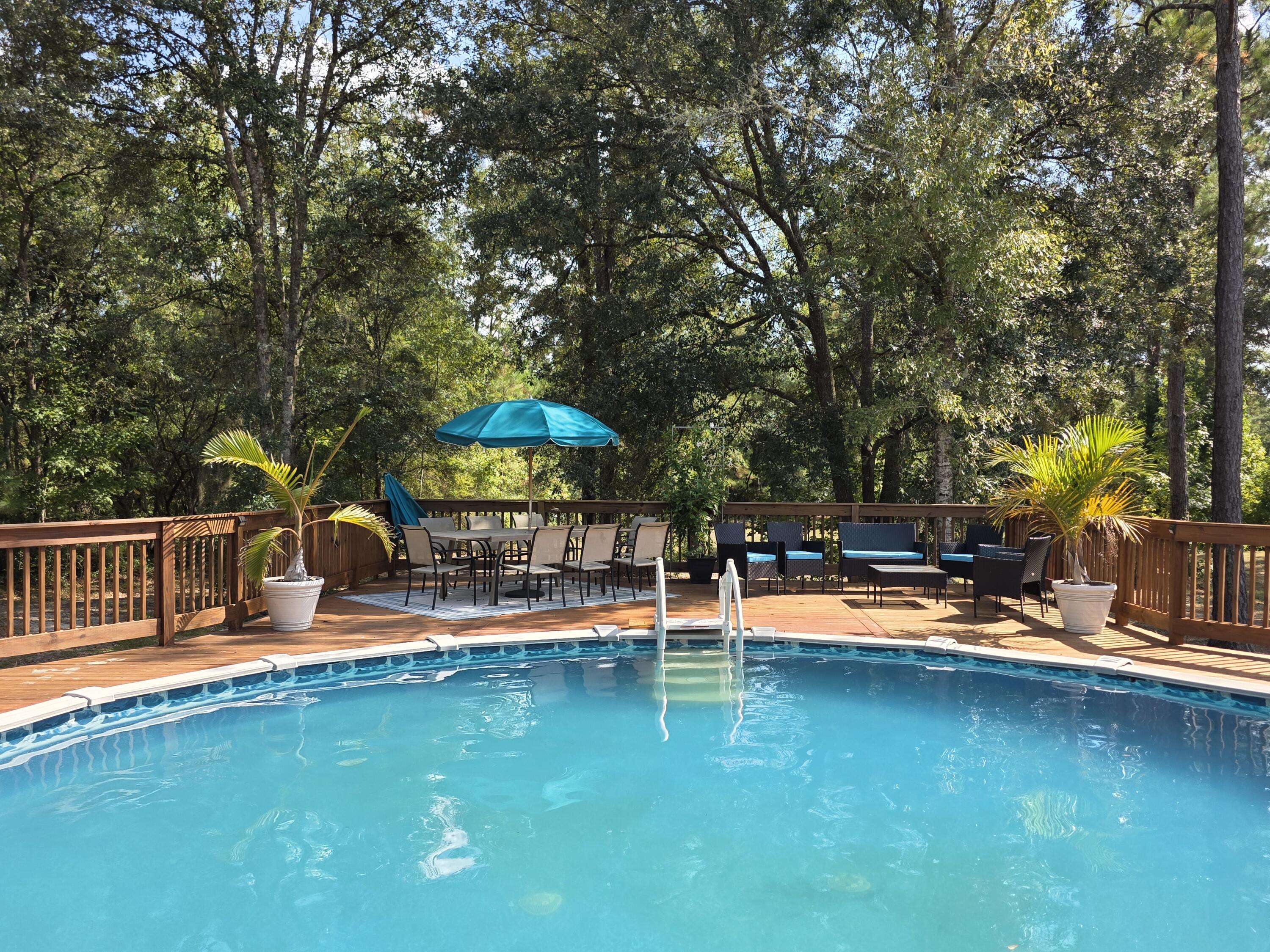 4320 Highway 79 Vernon, FL 32462 - Photo 37 of 49 a view of a swimming pool with a patio