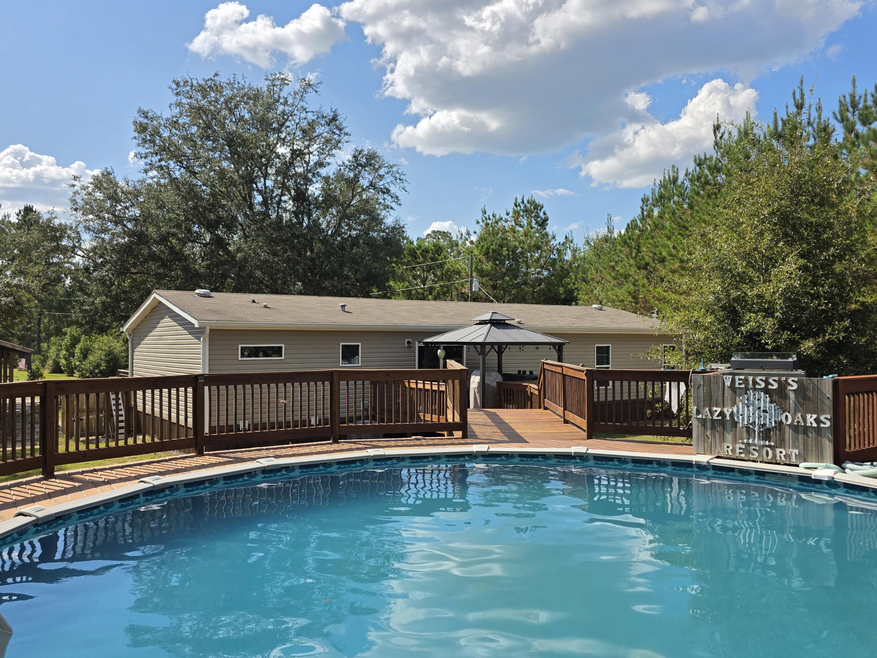 4320 Highway 79 Vernon, FL 32462 - Photo 38 of 49 a view of a house with a big yard