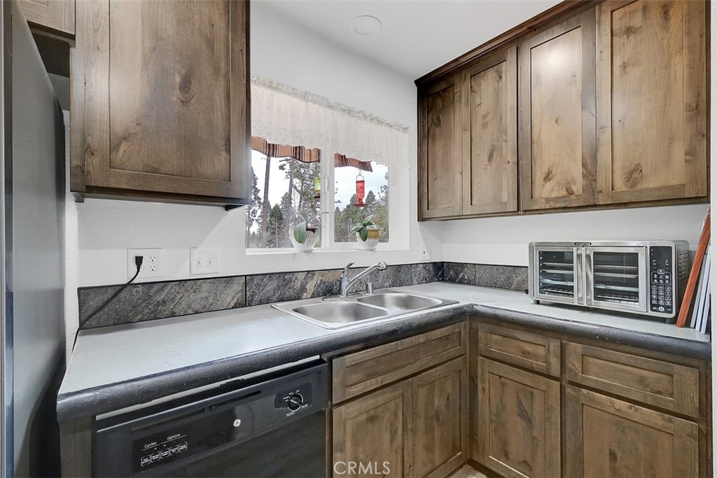14141 Racine Circle Magalia, CA 95954 - Photo 16 of 53 a kitchen with a sink cabinets and window