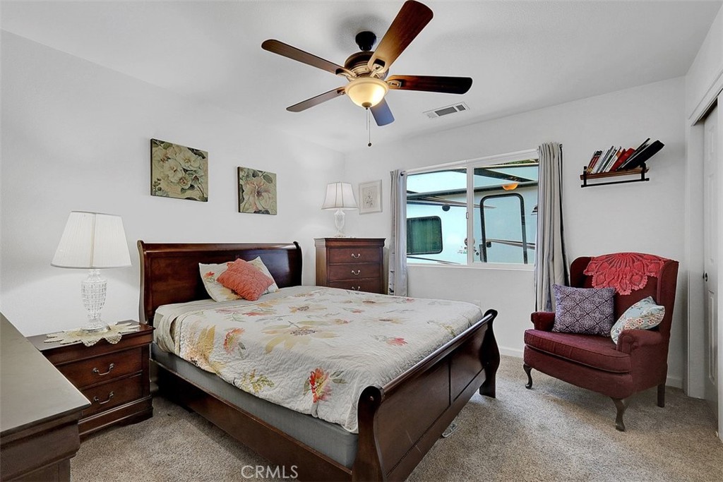 14141 Racine Circle Magalia, CA 95954 - Photo 22 of 53 a bedroom with a bed and a couch