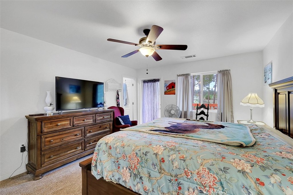 14141 Racine Circle Magalia, CA 95954 - Photo 23 of 53 a bedroom with a bed and a flat screen tv