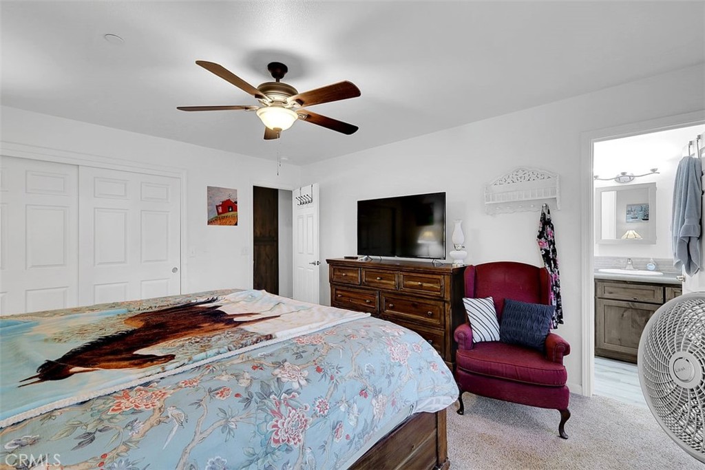 14141 Racine Circle Magalia, CA 95954 - Photo 25 of 53 a bedroom with a bed and a flat screen tv