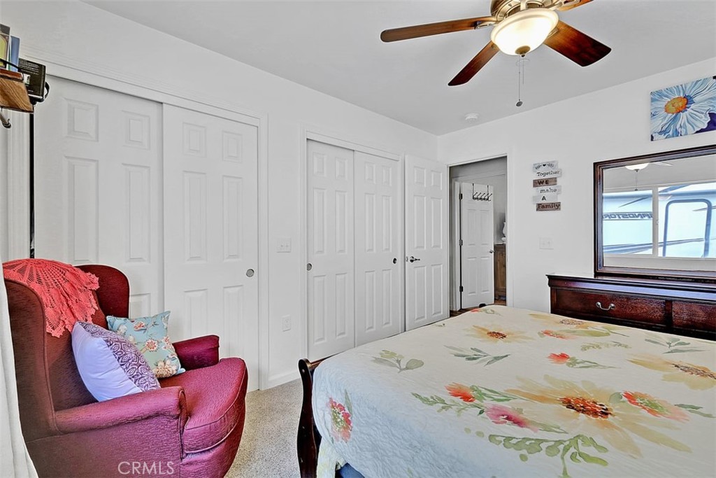 14141 Racine Circle Magalia, CA 95954 - Photo 27 of 53 a bedroom with a bed and ceiling fan