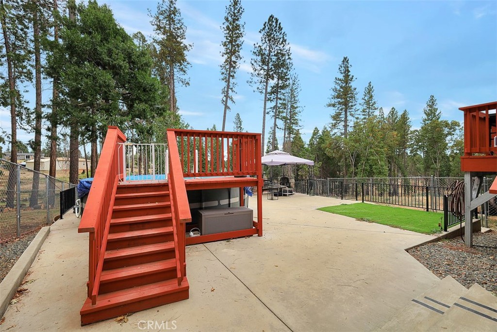 14141 Racine Circle Magalia, CA 95954 - Photo 33 of 53 a backyard of a house with barbeque oven and trees