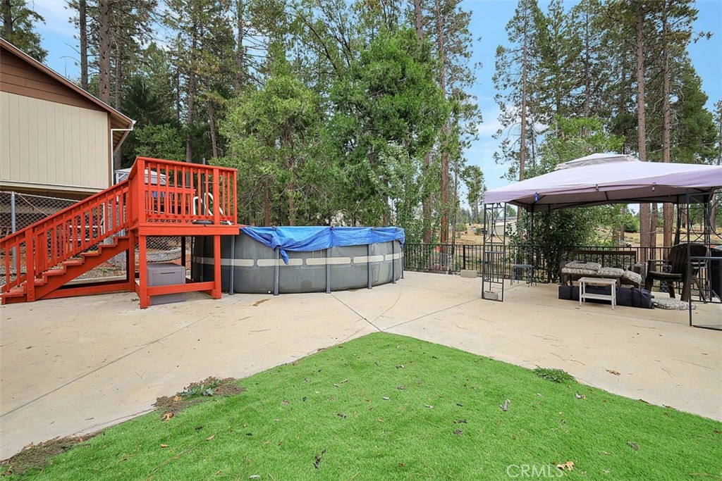 14141 Racine Circle Magalia, CA 95954 - Photo 34 of 53 a view of a house with a yard porch and sitting area
