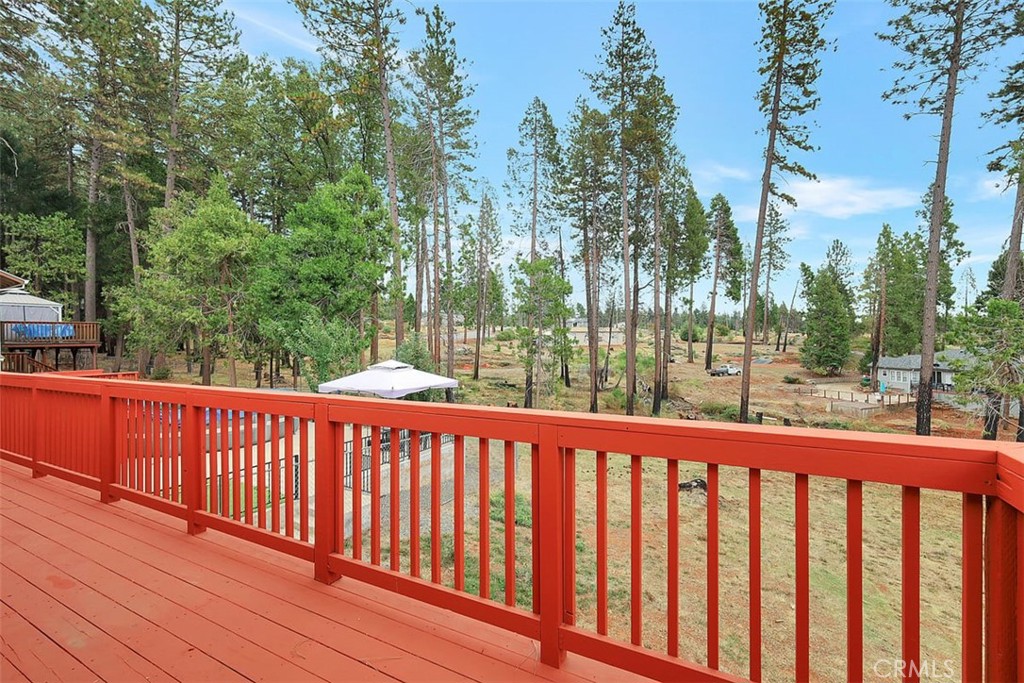 14141 Racine Circle Magalia, CA 95954 - Photo 37 of 53 a balcony with wooden floor and trees in the back
