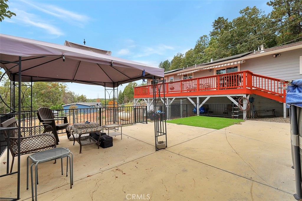 14141 Racine Circle Magalia, CA 95954 - Photo 38 of 53 a view of a patio with a table and chairs under an umbrella