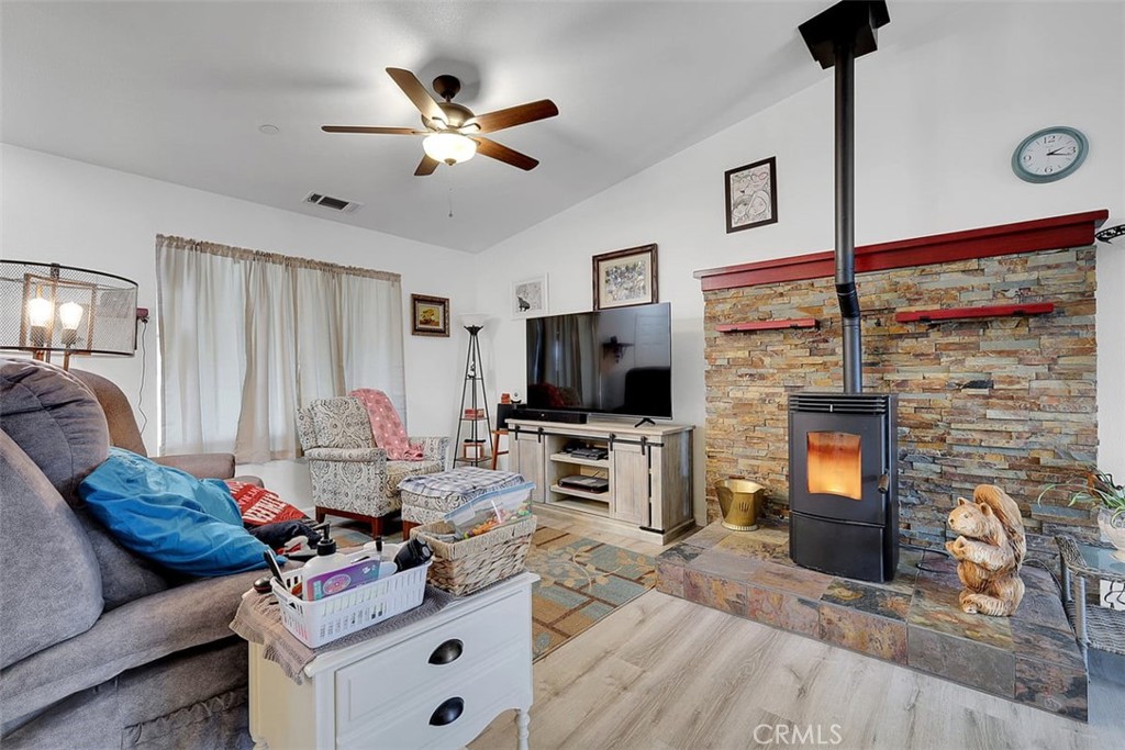 14141 Racine Circle Magalia, CA 95954 - Photo 10 of 53 a living room with furniture and a flat screen tv