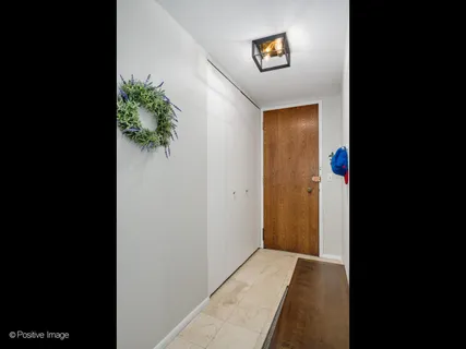 a view of a hallway with a flower pot