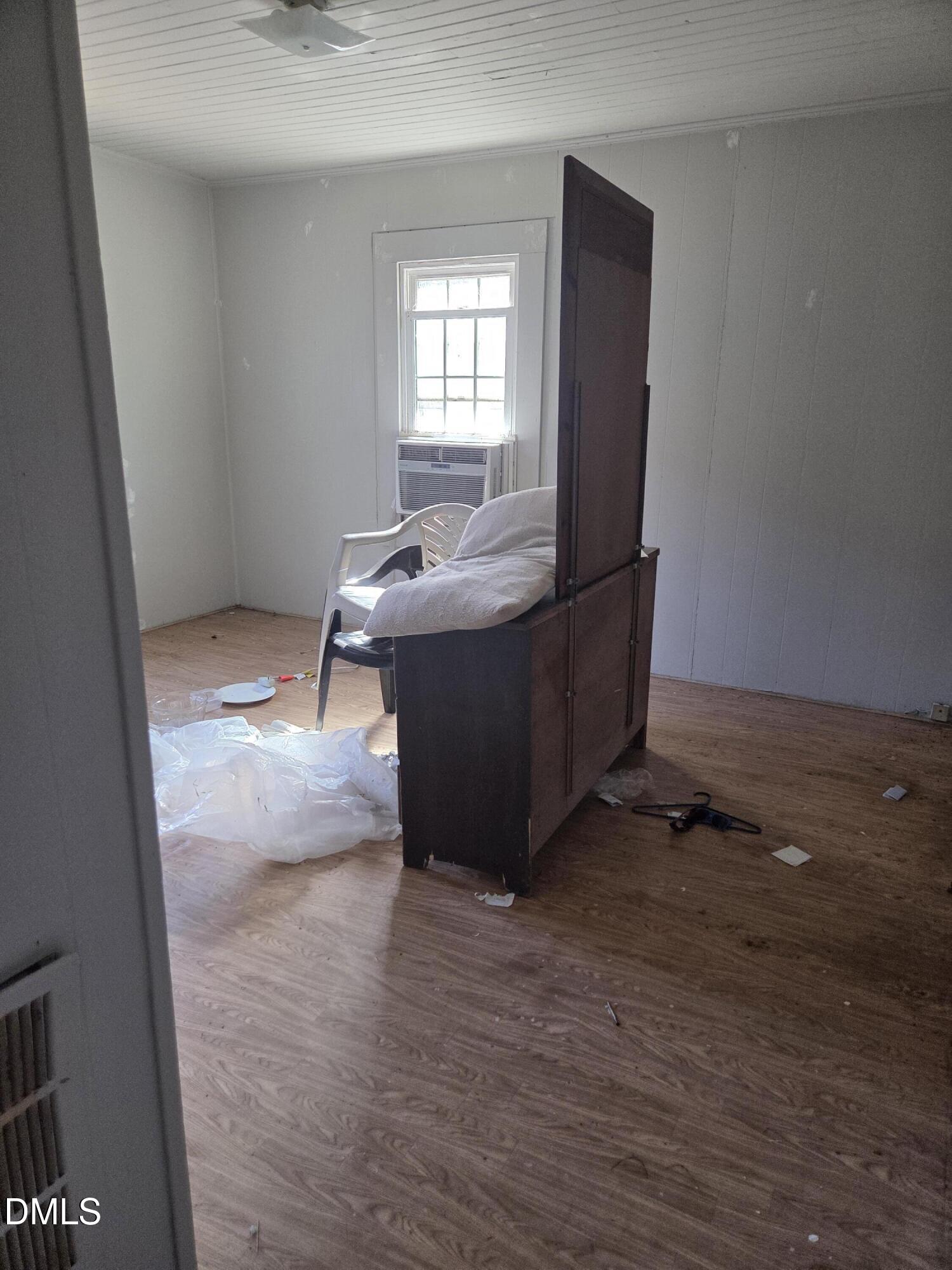 207 East Maple Street Mount Olive, NC 28365 - Photo 9 of 11 a view of a room with wooden floor and cabinet