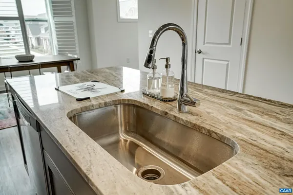 a kitchen with a sink and a window