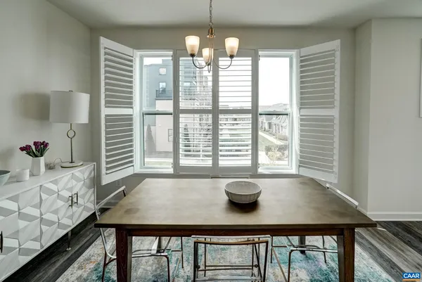 a view of a dining room with furniture and window