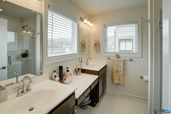 a bath room with a sink and a mirror