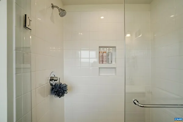 a bathroom with a shower and a shower
