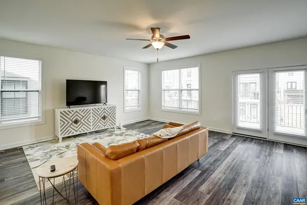 a living room with furniture and flat screen tv