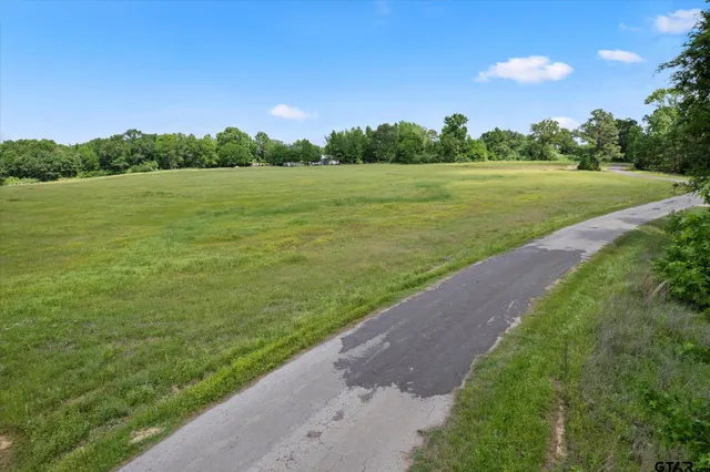a view of a lake with a yard