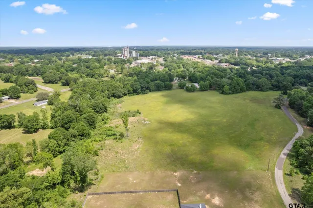 a view of an ocean yard and mountain view in back
