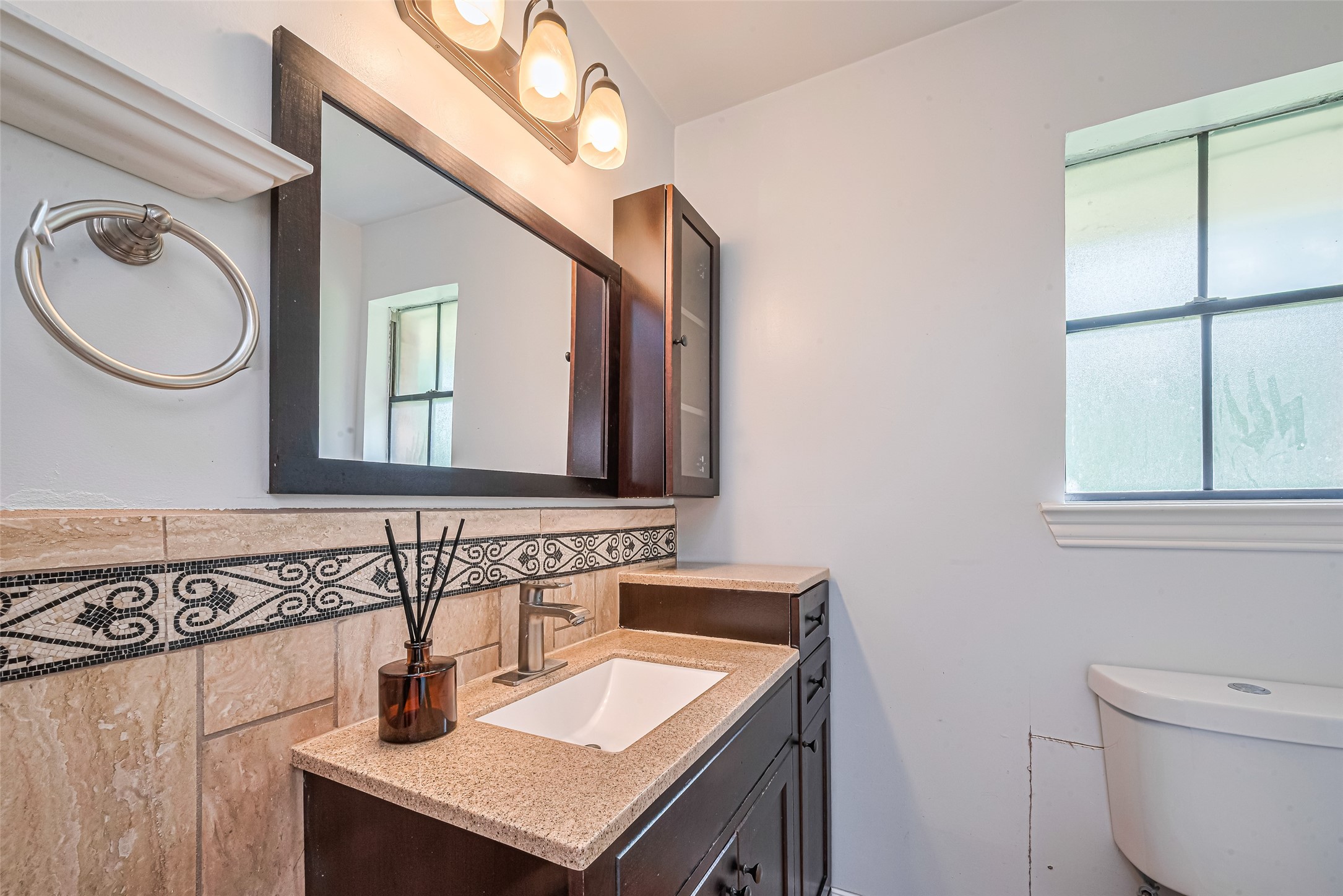24314 Anderson Street Huffman, TX 77336 - Photo 40 of 48 a bathroom with a sink and a mirror