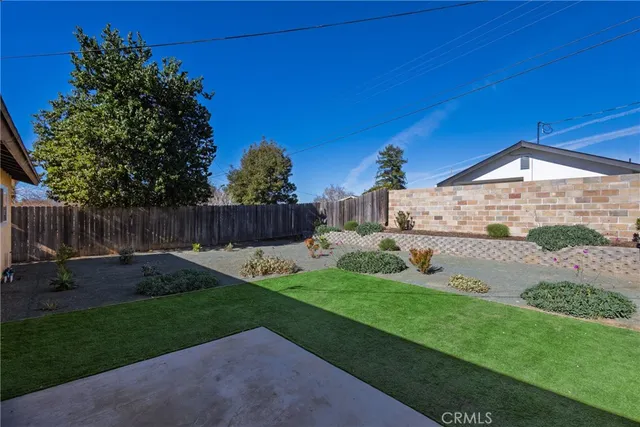 a house view with a backyard space