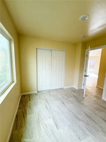 a view of an empty room and window