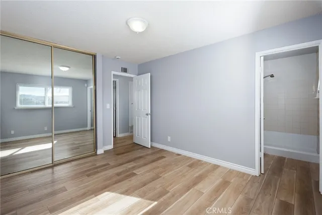 a view of a kitchen with a sink and a refrigerator