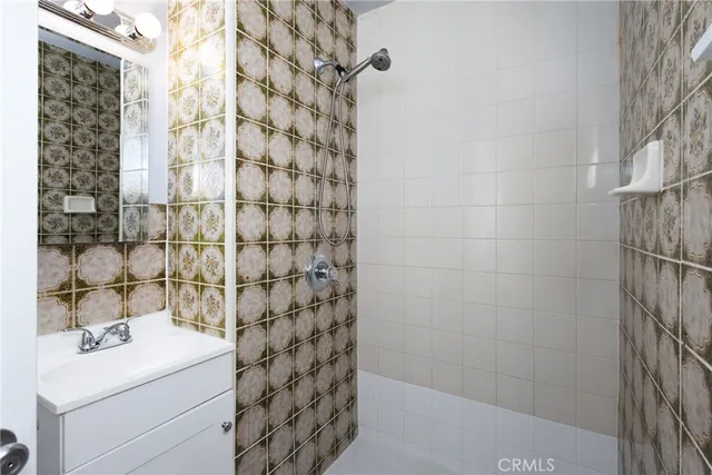 a kitchen with cabinets appliances a sink and a window