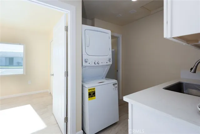 a kitchen with appliances cabinets and a sink