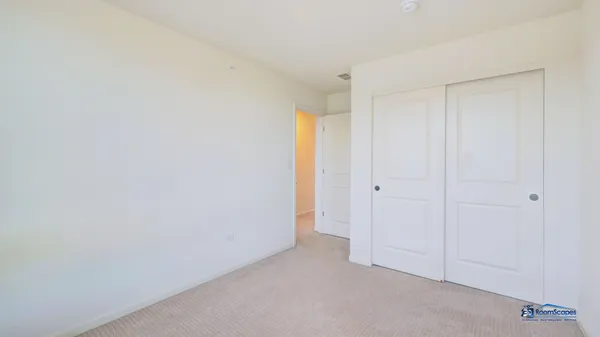 an empty room with windows