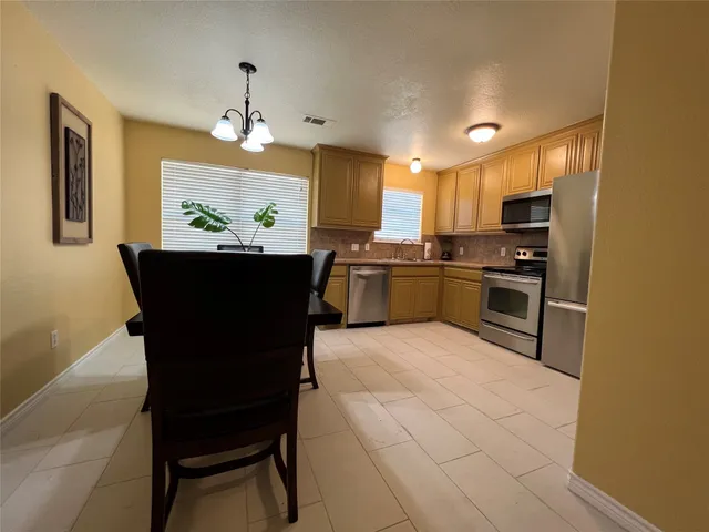 a view of a livingroom with furniture and a ceiling fan