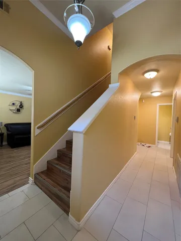 a large bedroom with wooden floor