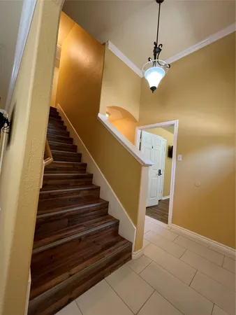 a view of entryway and hall with wooden floor