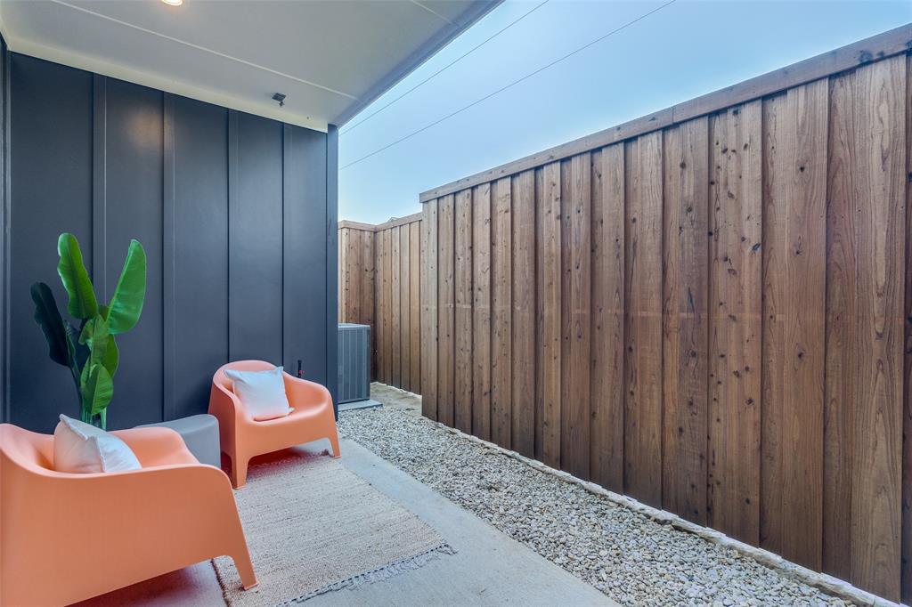 3940 Spring Valley Road, Unit 1 Farmers Branch, TX 75244 - Photo 18 of 19 a living room with furniture and a potted plant
