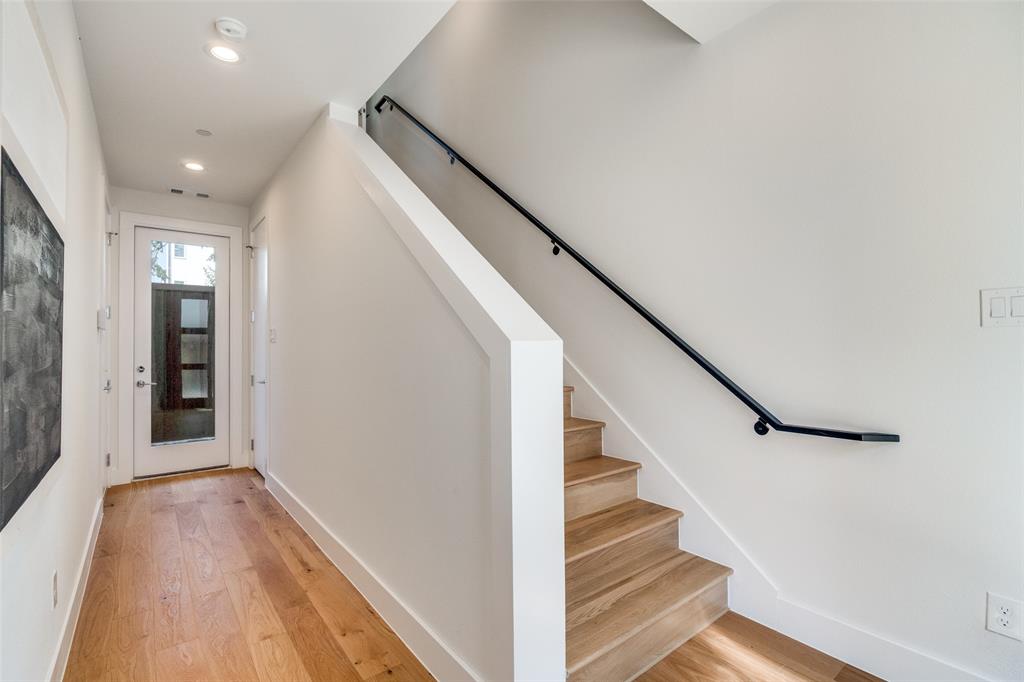 3940 Spring Valley Road, Unit 1 Farmers Branch, TX 75244 - Photo 4 of 19 a view of entryway with wooden floor and stairs