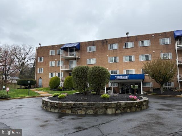 300 Byberry Road, Unit 202 Philadelphia, PA 19116 - Photo 2 of 32 a front view of a building with garden