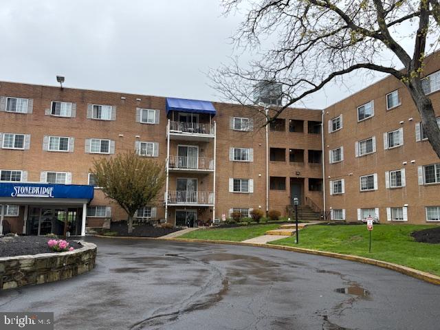 300 Byberry Road, Unit 202 Philadelphia, PA 19116 - Photo 3 of 32 a front view of a building with a garden