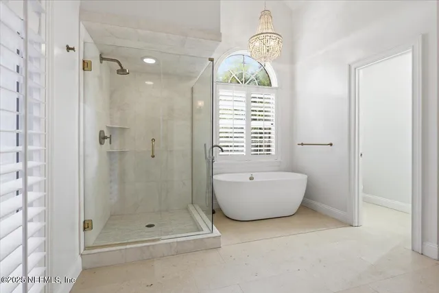 a bathroom with a bathtub and shower