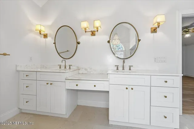 a bathroom with a double vanity sink and a mirror