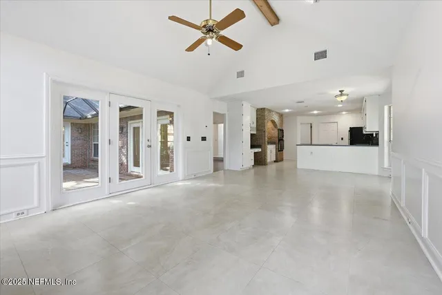 a view of a livingroom with a flat screen tv